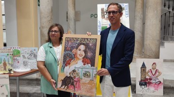 Santiago Cabello y Lola García con el cartel ganador